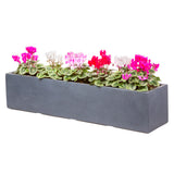 Large window box in Hampstead Lead Grey, planted with pink flowers - Bay and Box